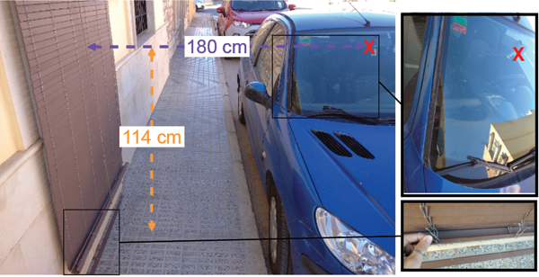 Figure 1: Photograph of the situation. The red cross represents the farthest scratch on the windscreen produced by the hooks when the blind was shaken by the wind.
